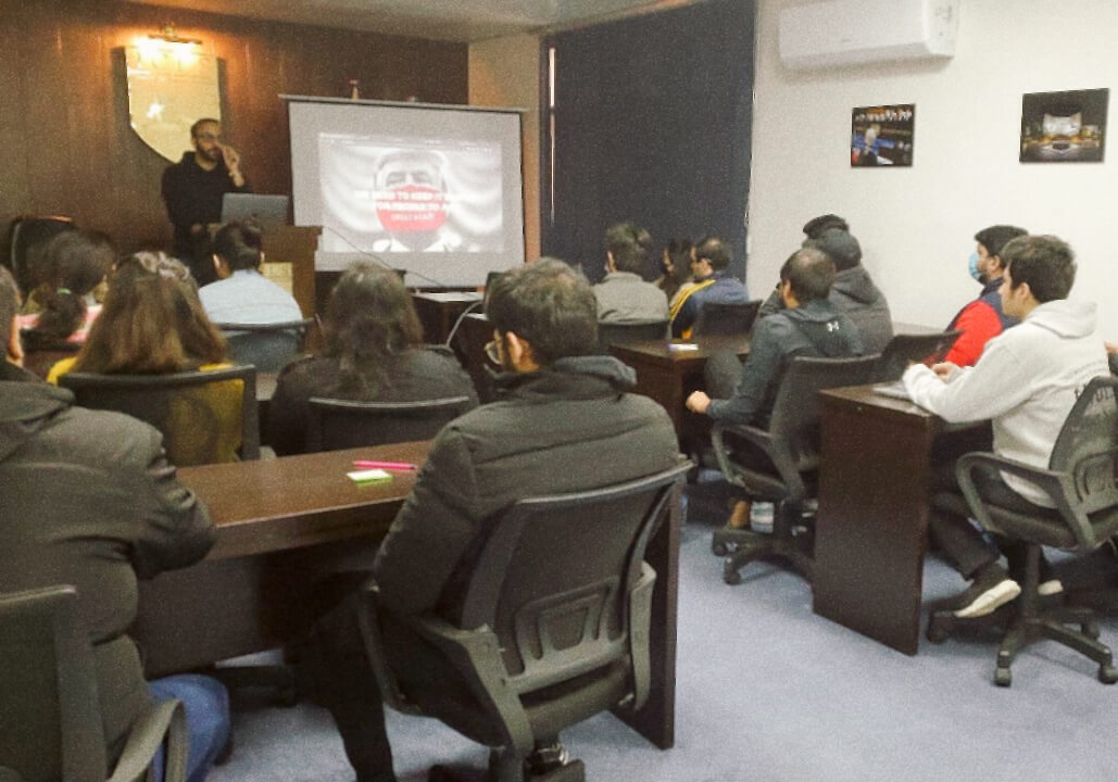 An early Phir/Se awareness workshop — a presenter and a seated audience watching a slide on air quality